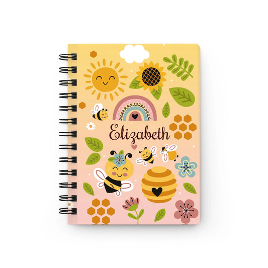 Bee Happy Personalized Spiral Journal front cover with smiling bees, rainbows, and flowers