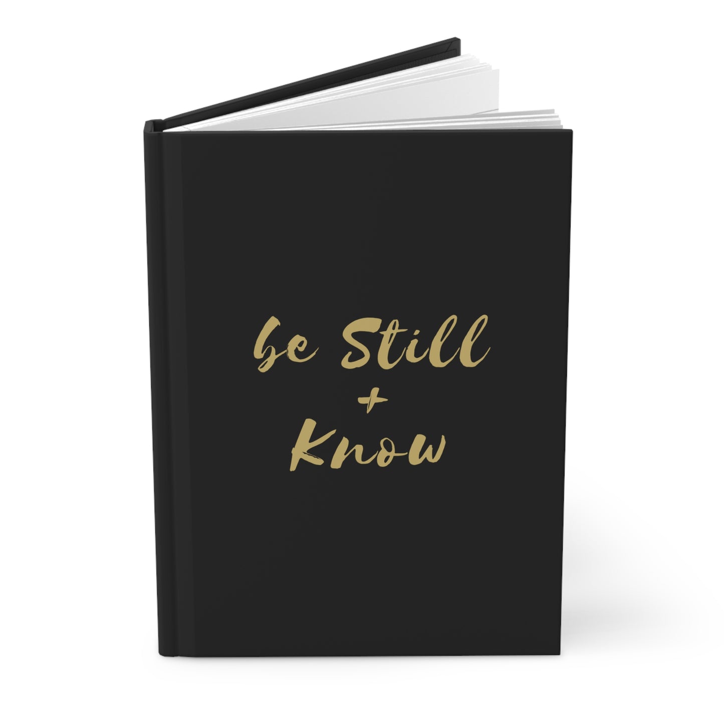 'Be Still & Know' journal placed on a cozy desk with a cup of coffee and pen, ideal for morning devotions