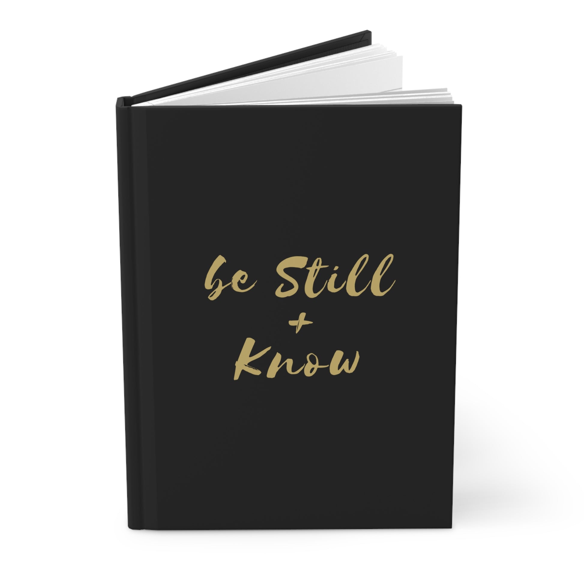 'Be Still & Know' journal placed on a cozy desk with a cup of coffee and pen, ideal for morning devotions